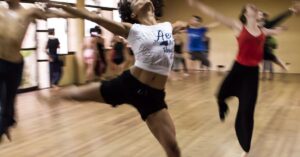 Dynamic group dance class showcasing diverse techniques and spirited expressions.